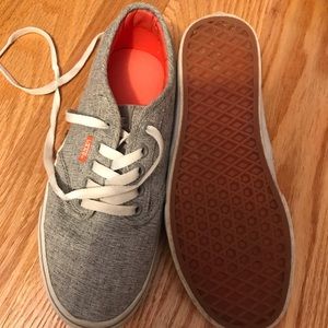 Women’s Vans lace up tennis shoes.